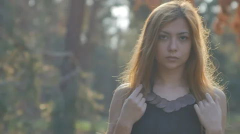 Woman backlit sunset rays in a forest Stock Footage 63929896