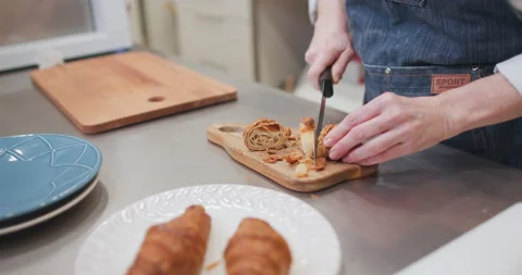 Woman baker preparing raw dough for pastry on baking manufacture Stock Footage 237909045