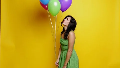 Woman with ballons at studio Stock Footage 81752502