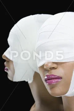 A Woman With Bandages Wrapped Around Her Face