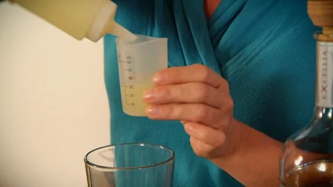 Woman Bartender Using Measuring Cup For Liquor Drink Video stock 107333329