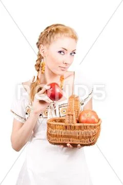 Woman with basket of apples Stock Photos
