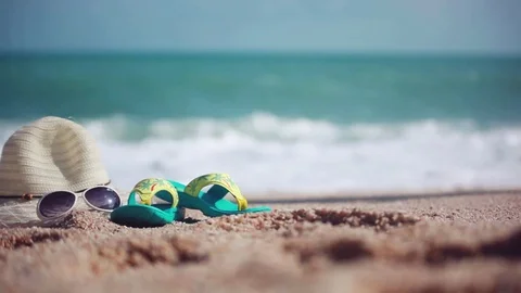 Woman on the Beach. Female feet walks along the beach and the Sea on hat Stock Footage