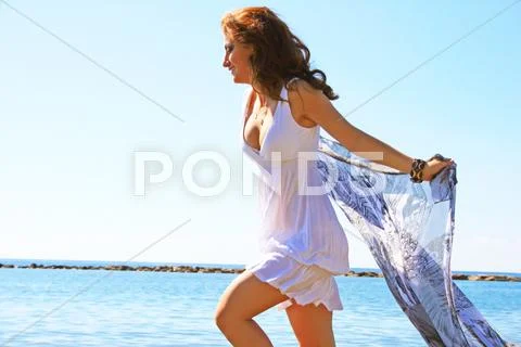 Woman on beach Stock Photos