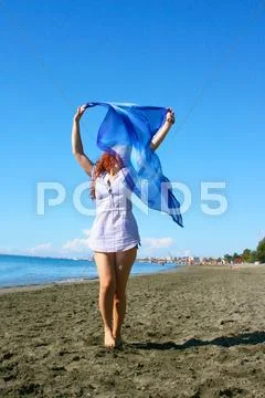 Woman on beach Stock Photos