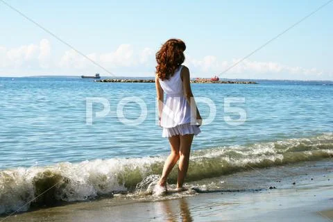 Woman on beach Stock Photos
