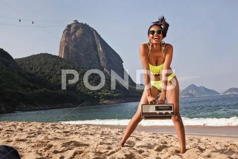 Woman On Beach With Vintage Radio, Rio De Janeiro, Brazil