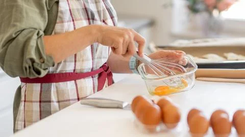 Woman Beating Egg For Baking Stock Photos
