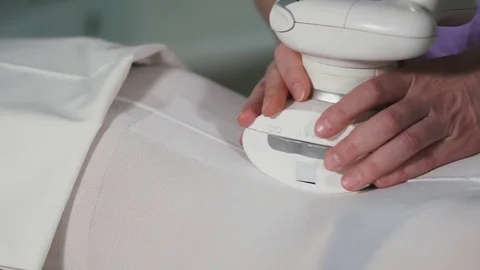 Woman at the beautician. Doctor uses hardware for LPG vacuum massage on body. Stock Footage