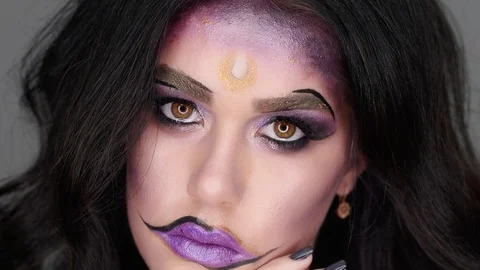 Woman with beautiful make-up posing on camera. She has a tear Stock-Footage 97457776