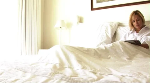 Woman in bed Stock Footage 43684427