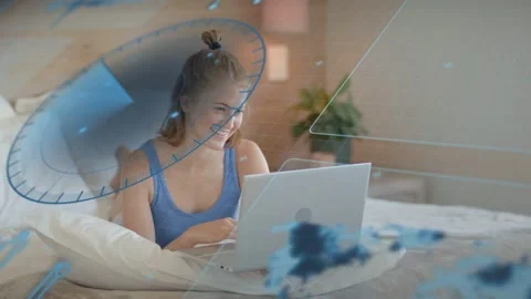 Woman on bed using laptop, typing and scrolling, activating blue HUD compass Stock Footage 333336678