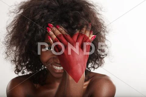 Woman behind her hands wis a red heart drawn on it Stock Photos