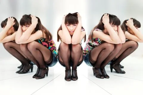 Woman between two mirrors Foto stock