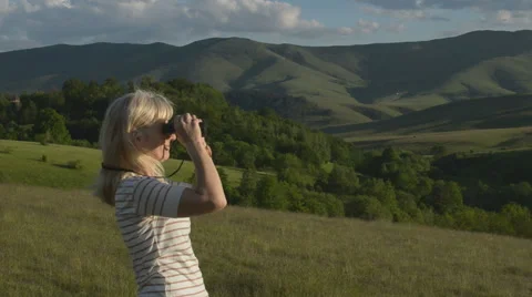 Woman With Binoculars Stock Footage 67314909