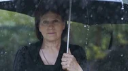 Woman At Black Clothes Under Umbrella At Rain Stock Footage