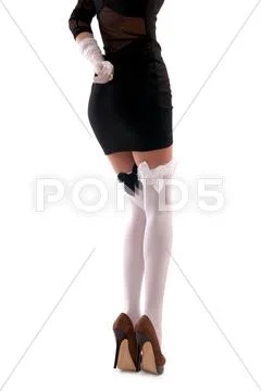 Woman in black dress and white stockings Stock Photos