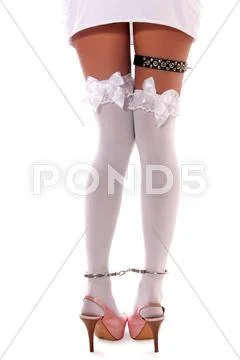 Woman in black dress and white stockings Stock Photos