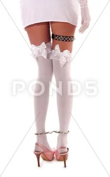 Woman in black dress and white stockings Stock Photos