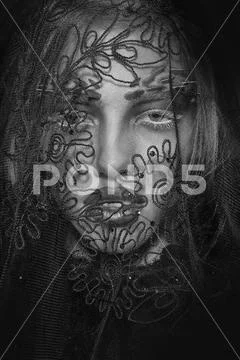 Woman in black lace veil Stock Photos