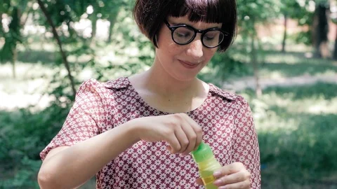 Woman blowing bubbles Stock Footage 110862494