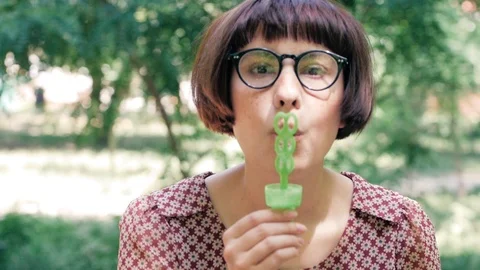 Woman blowing bubbles Stock Footage 110862515