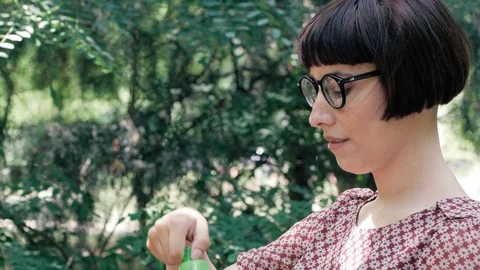 Woman blowing bubbles Stock Footage 110862536