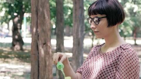 Woman blowing bubbles Stock Footage 110862595