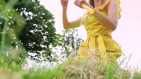 Woman blowing bubbles Stock Footage 118089560