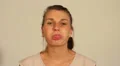 Woman blowing a raspberry at the camera HD Footage