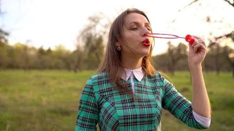 Woman Blowing Soap Bubbles Outdoors Sl Stock Video Pond