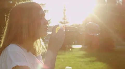 Woman blows bubbles Stock Footage 66247805