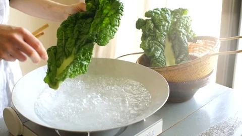 Woman boiling vegetables Stock Footage 124401546