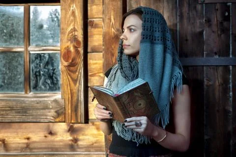 Woman with a book on her hands Stock Photos