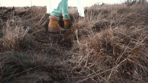 Woman Boots Walking in Field Stock Footage