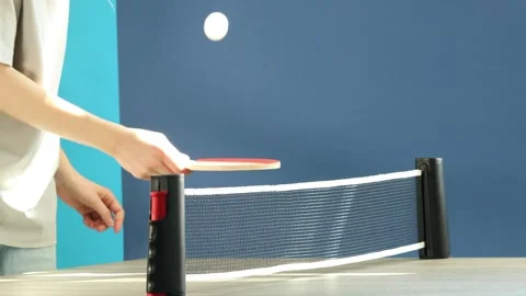 Woman bouncing ping pong ball with racket indoors, closeup Stock Footage 308598696