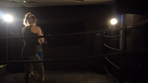 Woman boxer exercising in the ring Stock Footage 101200228