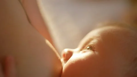 Milk flows from woman breast. Close up video of nipple. Breastfeeding.