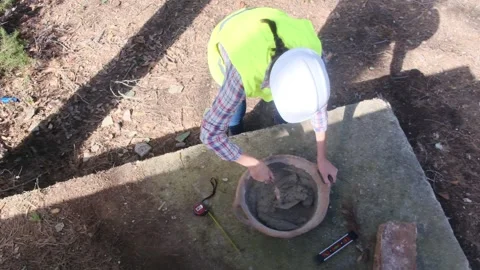 Woman bricklayer works in construction using and preparing cement Vídeos de archivo 270455670