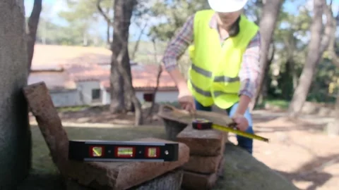 Woman bricklayer works in construction using and preparing cement Vídeos de archivo 270456011