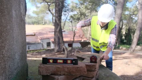 Woman bricklayer works in construction using and preparing cement Vídeos de archivo 270456098