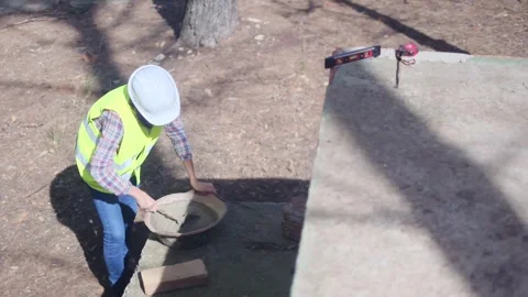 Woman bricklayer works in construction using and preparing cement Vídeos de archivo 270456429