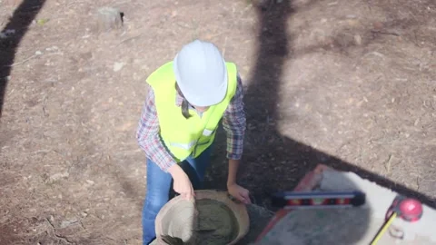 Woman bricklayer works in construction using and preparing cement Видео 270456455