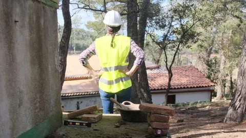 Woman bricklayer works in construction using and preparing cement Vídeos de archivo 270456567