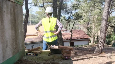 Woman bricklayer works in construction using and preparing cement Vídeos de archivo 270456589