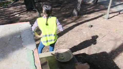 Woman bricklayer works in construction using and preparing cement Видео 270456659