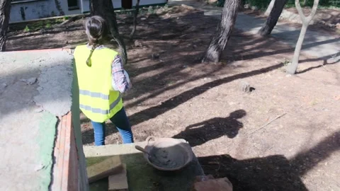 Woman bricklayer works in construction using and preparing cement Vídeos de archivo 270456665