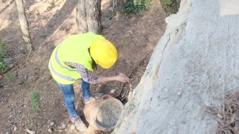 Woman bricklayer works in construction using and preparing cement Vídeos de archivo 270457623