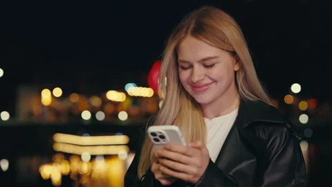 Woman Browsing on Internet While Standing Outside Alone at Night. Stock Footage 248674060