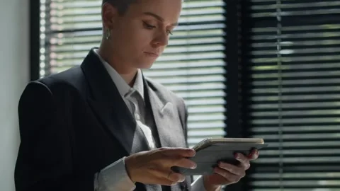 Woman browsing internet via wireless device. Business assistant doing her job Video stock 253628783